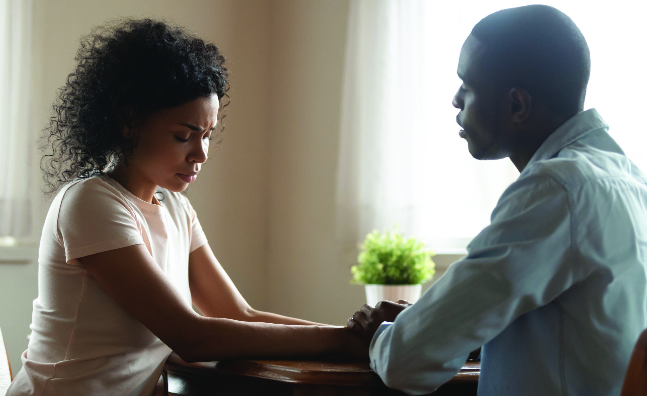 African,spouses,married,couple,sit,together,hold,hands,loving,husband